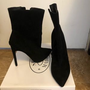 Sleek pointy toe high heeled booties